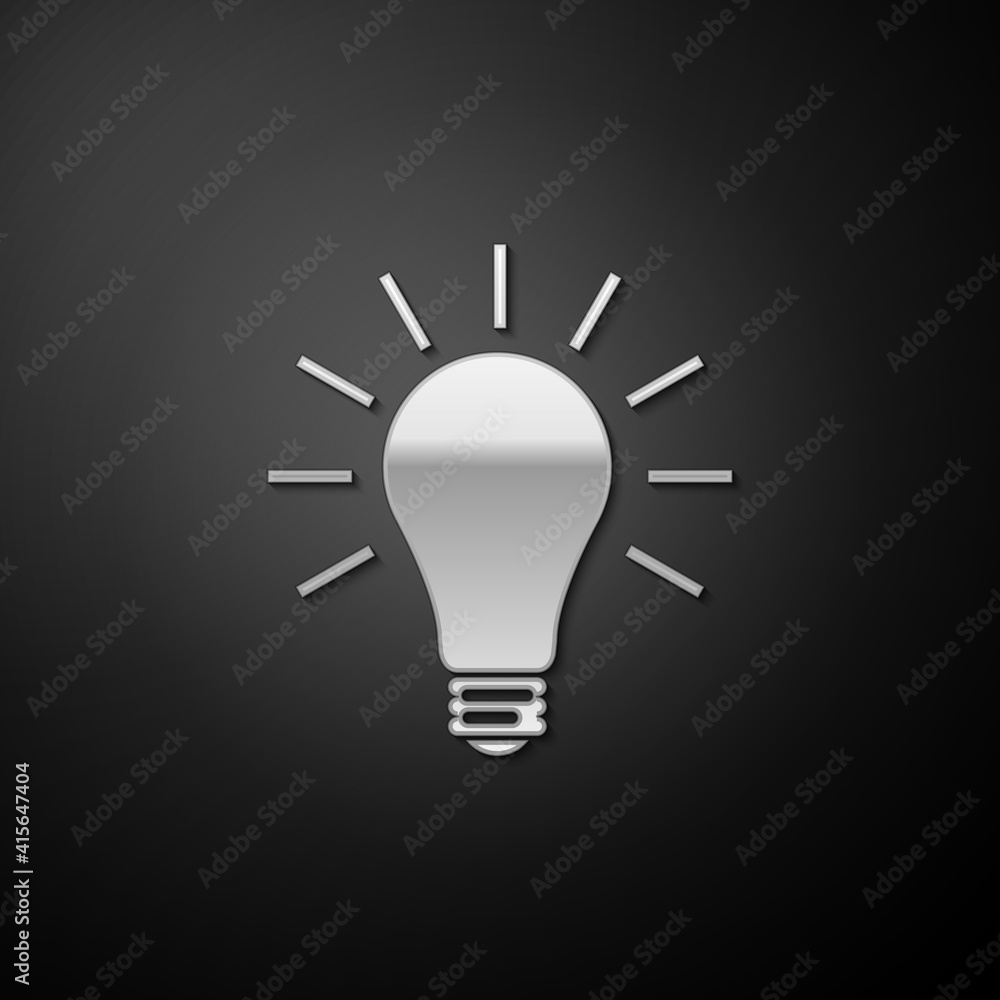Silver Light bulb with rays shine icon isolated on black background. Energy and idea symbol. Lamp electric. Long shadow style. Vector. Silver Light bulb with rays shine icon isolated on black background. Energy and idea symbol. Lamp electric. Long shadow style. Vector.
