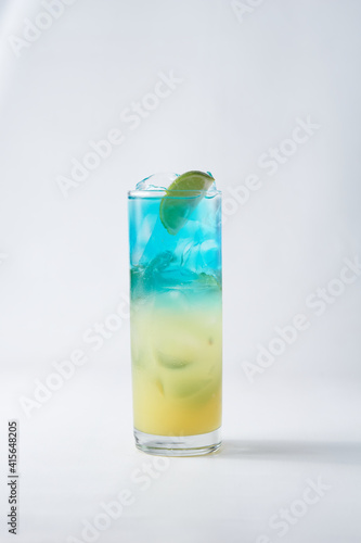isolated glass with ice and lime