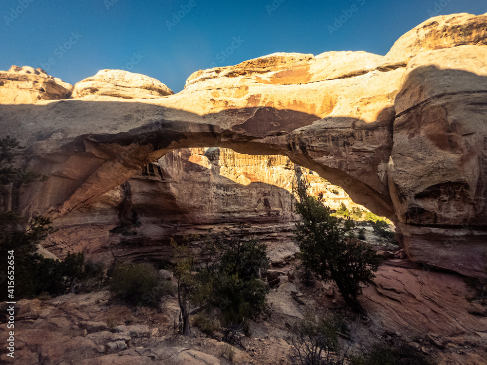 Close up of sandstone arch with last sun rays in Capitol Reef national park in Utah, america