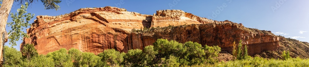 Panorama shot of red sriped sandstone mountain in Capitol Reef national park in Utha, America Panorama shot of red sriped sandstone mountain in Capitol Reef national park in Utha, America