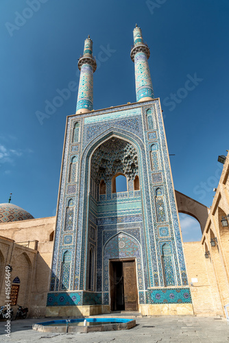 IRAN, YAZD - DECEMBER 22, 2018. The grand iwan of Jameh mosque in Yazd. Portal and minarets. Iran.