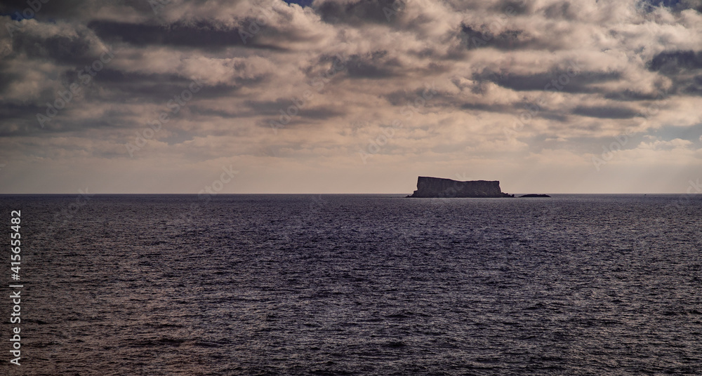 Cliff separate island in the middle of the sea in Malta