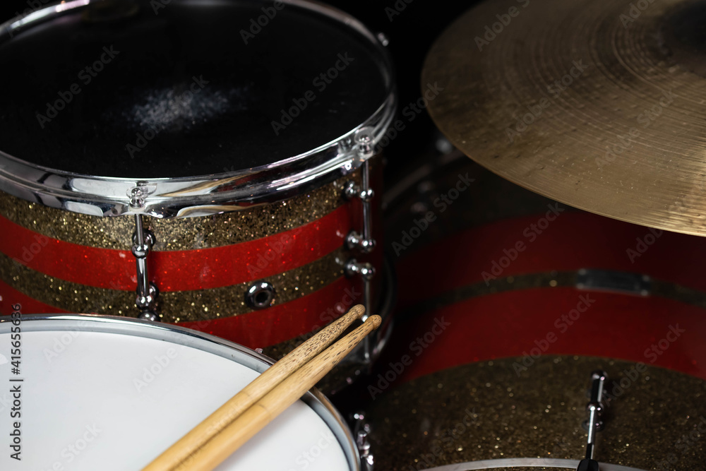 Obraz premium Closeup of drumsticks lying on the professional drum set. Drummer equipment. 