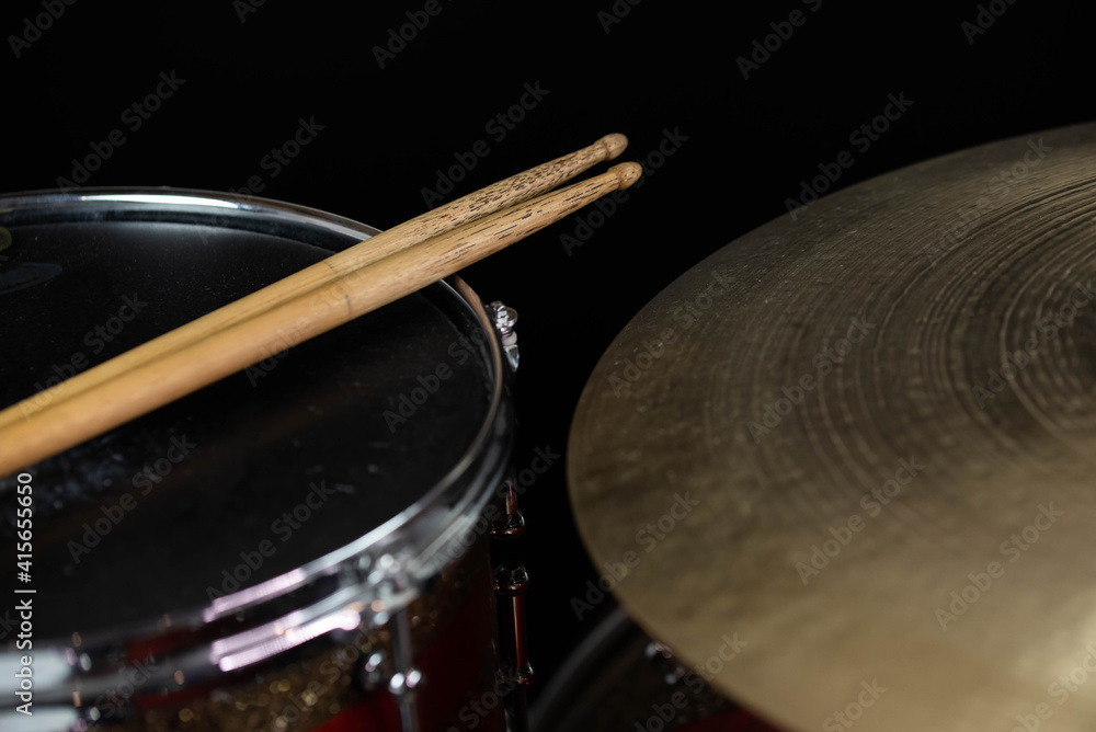 Fototapeta premium Closeup of drumsticks lying on the professional drum set. Drummer equipment. 