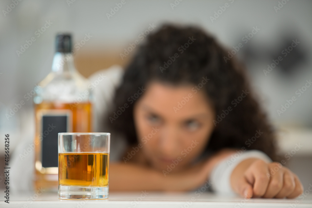 picture of woman looking at alcoholic drink picture of woman looking at alcoholic drink