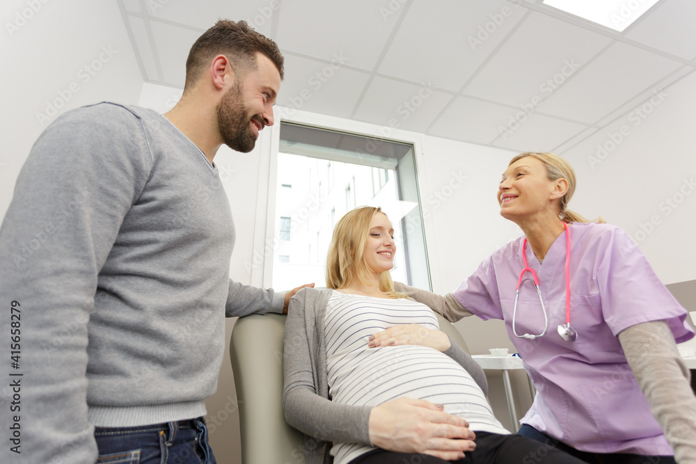 pregnant woman and husband during consultation pregnant woman and husband during consultation