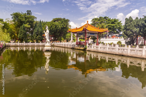 IPOH, MALAYASIA - MARCH 25, 2018: Small pond near Perak Tong temple in Ipoh, Malaysia.