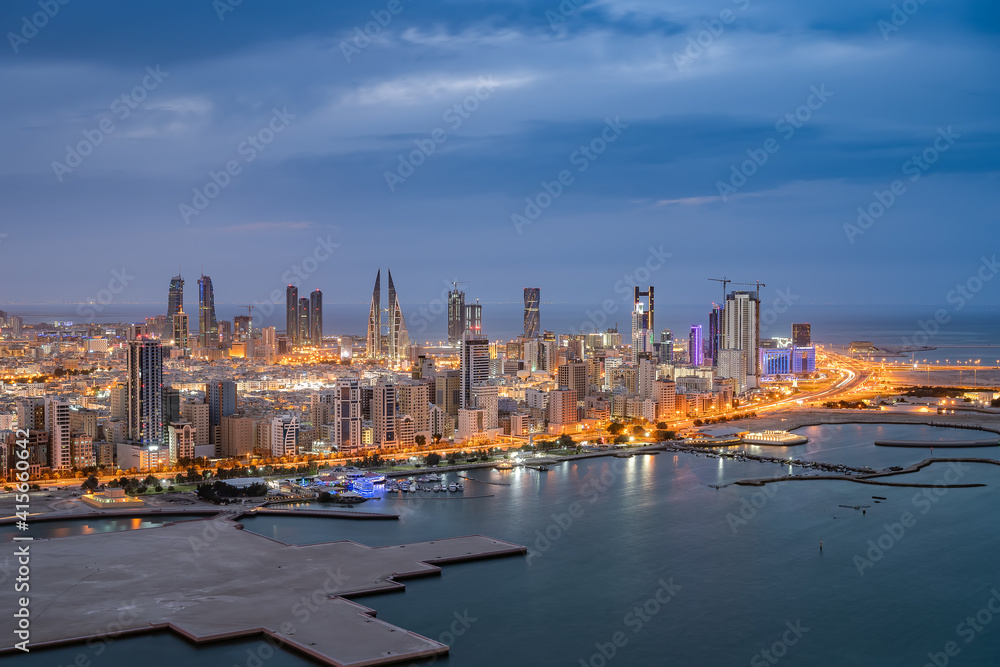 Obraz premium Aerial view of Manama city skyline at twilight and newly constructed areas in Manama, Bahrain.