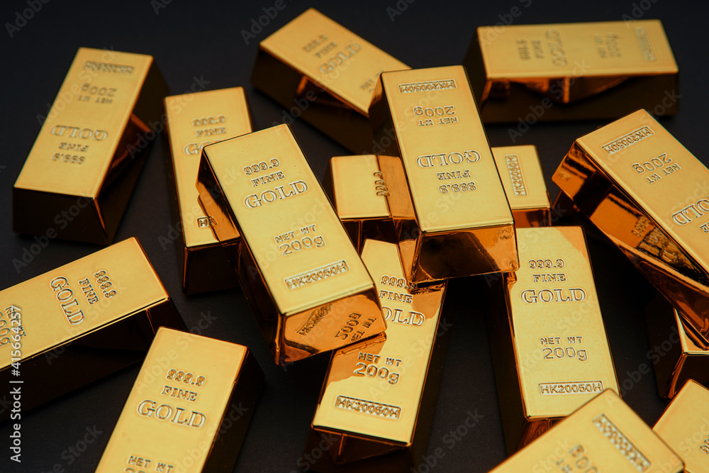 Scattered gold bars on the black table. Shiny precious metals for investments or reserves. Bank image and photo. Scattered gold bars on the black table. Shiny precious metals for investments or reserves. Bank image and photo.