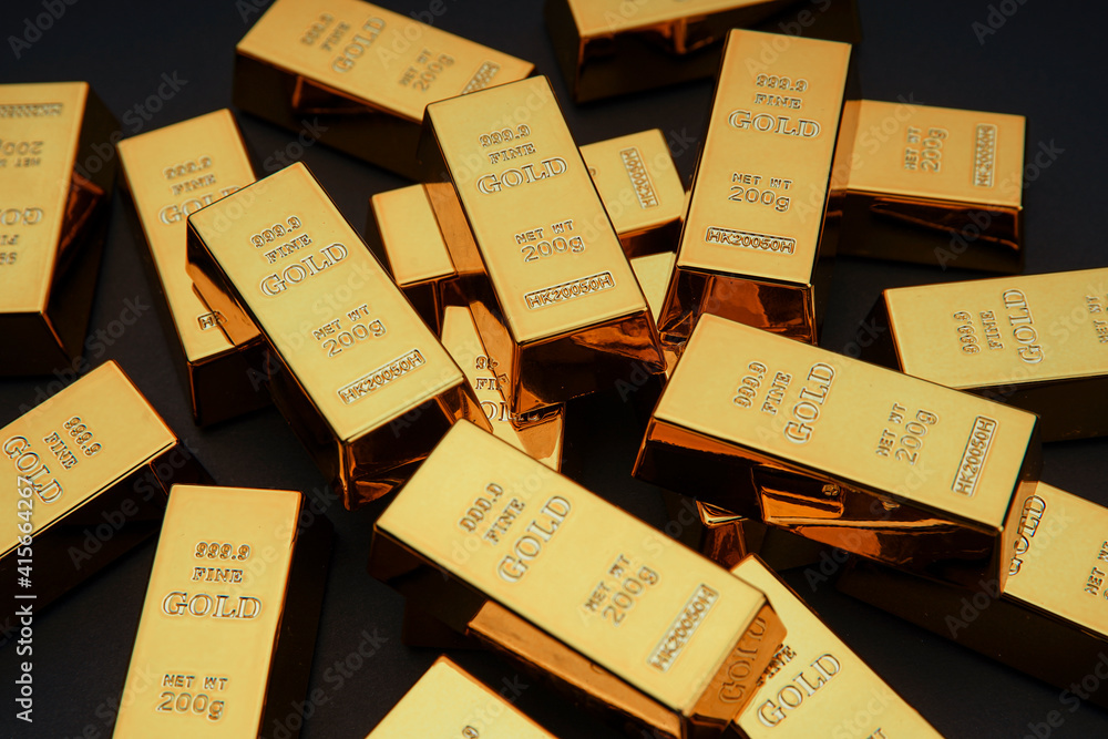 Scattered gold bars on the black table. Shiny precious metals for investments or reserves. Bank image and photo. Scattered gold bars on the black table. Shiny precious metals for investments or reserves. Bank image and photo.