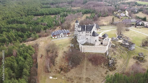 View from drone of renovated medieval royal Bobolice Castle located in Krakow-Czestochowa Upland (Polish Jura) on spring day, Poland photo