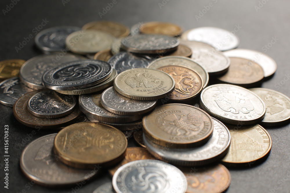 Many coins on a black background Many coins on a black background