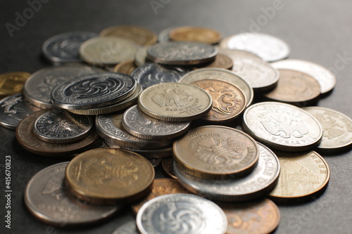 Many coins on a black background