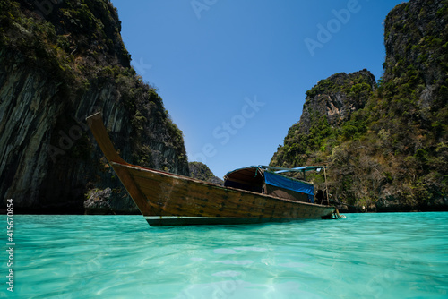Long-Tail Boat in Crystal blue water © Sayed