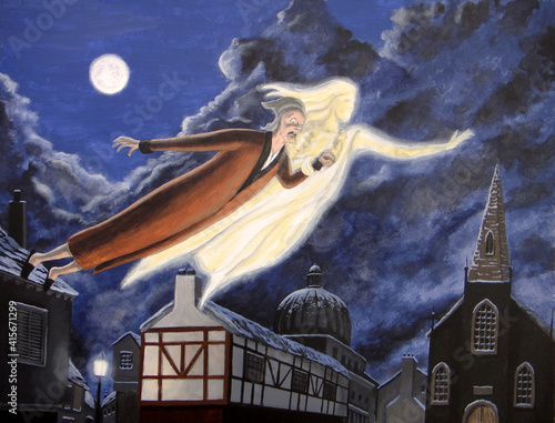 The Ghost of Christmas Past soars over the city with Ebenezer Scrooge in tow.   photo