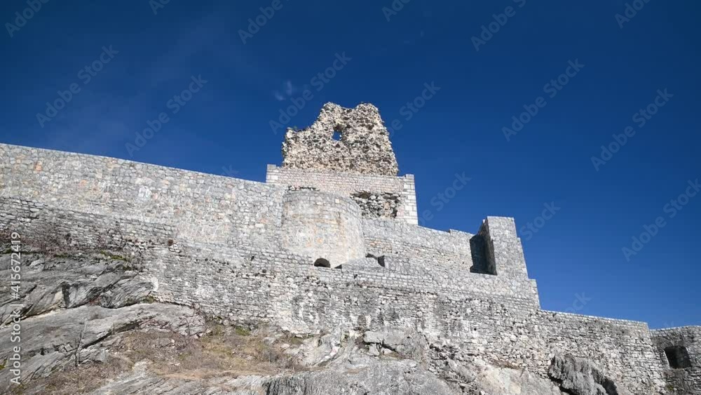 Old Smlednik castle ruins in Slovenia. Defensive wall of medieval ruins in Europe. Castle was built in the 12th century on the foundations of a prehistoric fort. Forward dolly moving, wide angle Old Smlednik castle ruins in Slovenia. Defensive wall of medieval ruins in Europe. Castle was built in the 12th century on the foundations of a prehistoric fort. Forward dolly moving, wide angle
