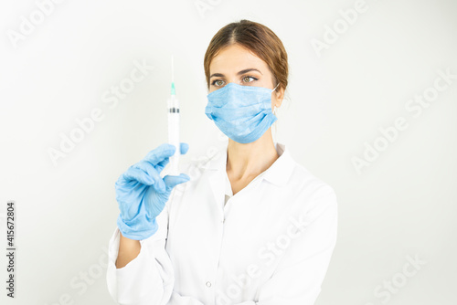 Concept fight against virus covid-19 corona virus  doctor or scientist in laboratory holding a syringe with liquid vaccines  Concept diseases medical care science.   