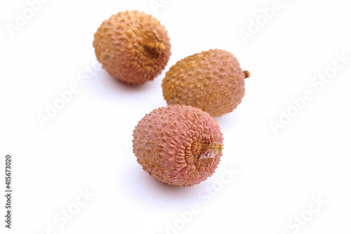 lychee fruits grouped on white background, isolated, close up photo