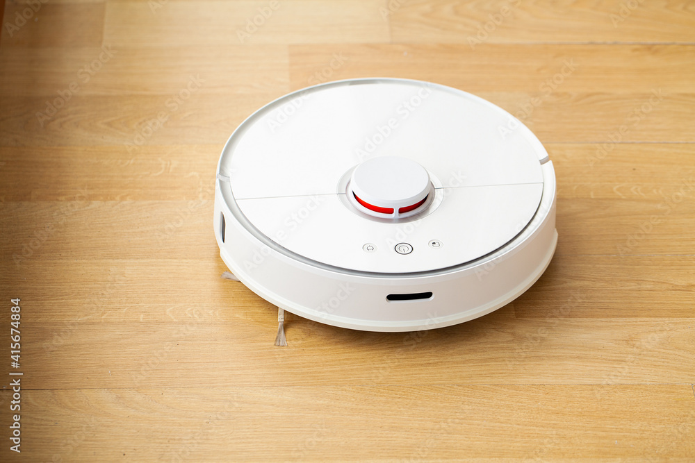 Robot vacuum cleaner performs automatic cleaning of the apartment at a certain time. Smart home. Robot vacuum cleaner performs automatic cleaning of the apartment at a certain time. Smart home.