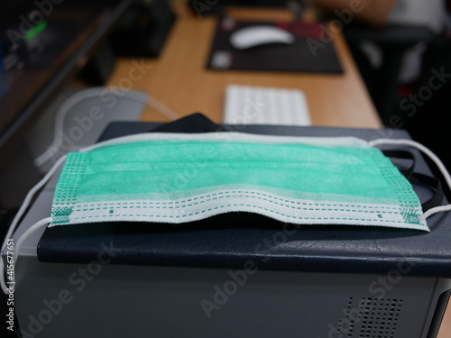 Wallpaper Mural protective medical mask placed on table at office,new normal concept. Torontodigital.ca