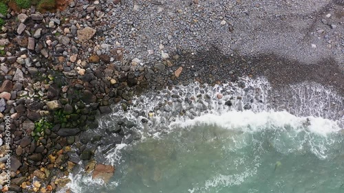 Waves Crashing On Stony Shoreline In Costa Vicentina, Portugal During Summer. - Aerial Ascending Shot
