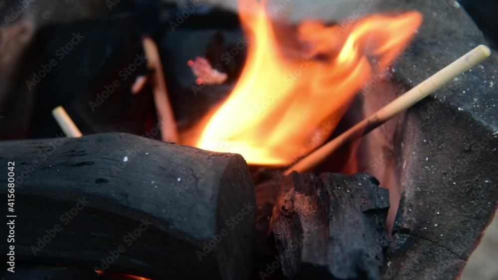 Fire on chaco with smoking.