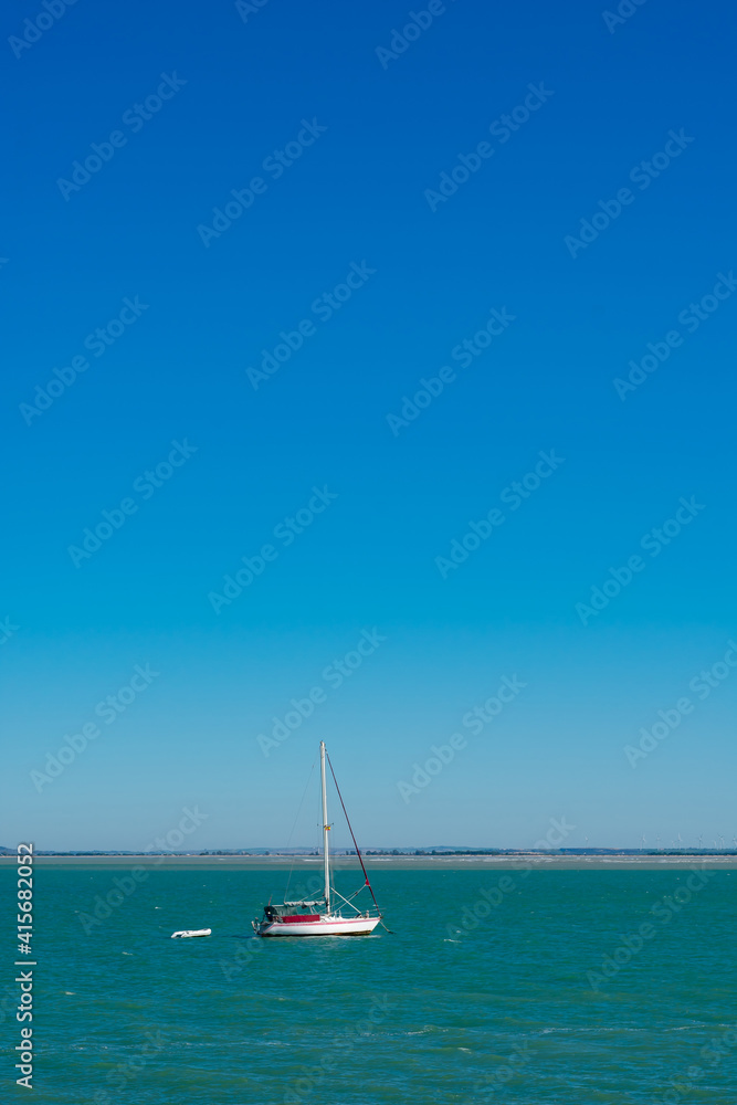 Naklejka premium sailing boat in the bay of Cadiz, Andalusia. Spain. Europe.