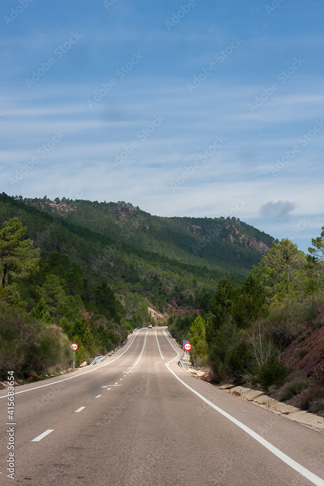 Road to mountains with blue sky