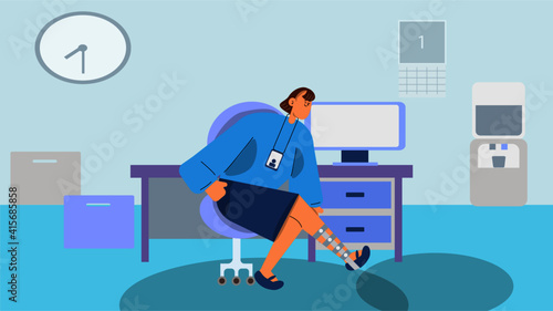 Woman in leg brace sitting in office, trying to work.