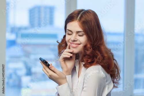 Business woman with phone in hands Office professional work technology