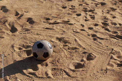 soccer ball on the sand