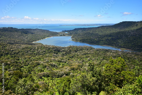 Bird view of Lower Nihotupu Dam surrounded by Waitakere Ranges from Arataki Visitor Centre in West Auckland. photo
