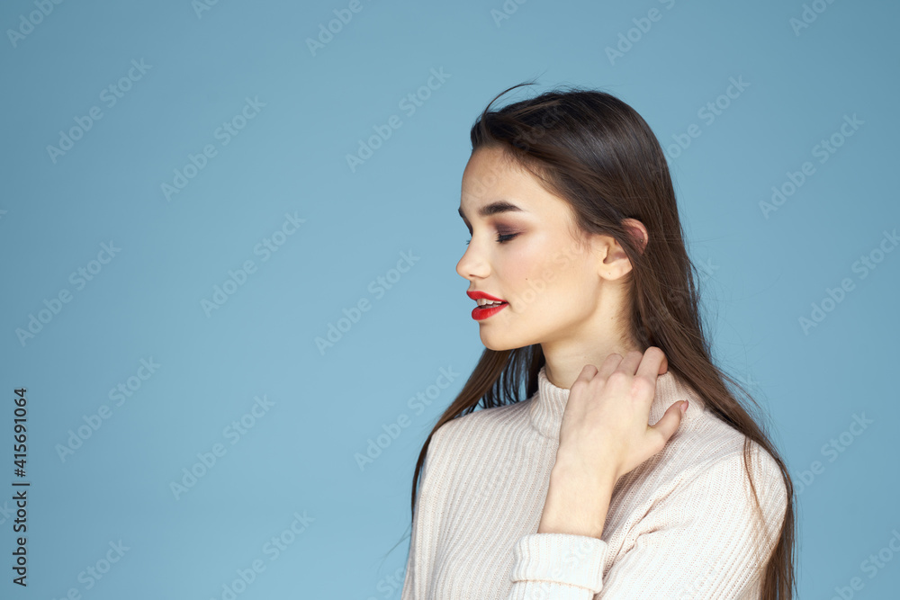 Brunette in white sweater red lips charm cropped view blue background Brunette in white sweater red lips charm cropped view blue background