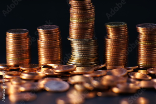 stack of coin on table background and business or finance saving money