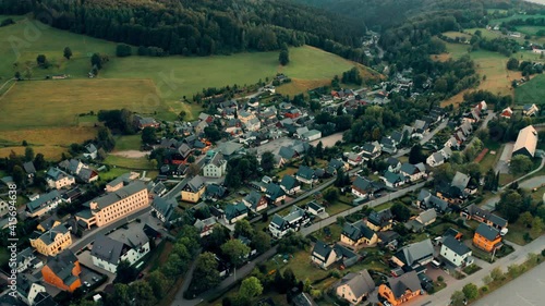 german town of Seiffen extending between high green hills, Aerial view photo