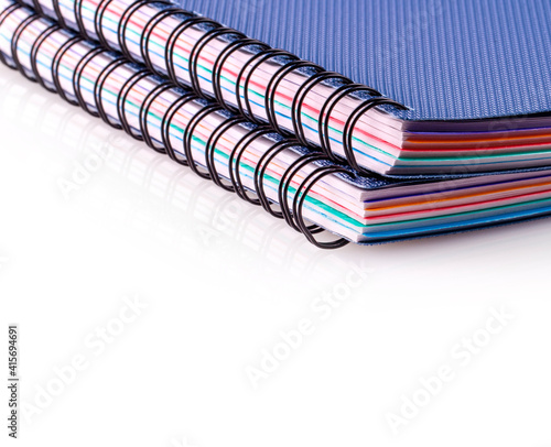 Two Blue diary spiral notebookes on white