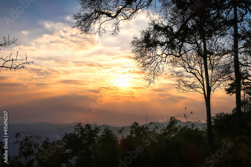 The landscape of natural mountains and hill with sunrise  trees are silhouette