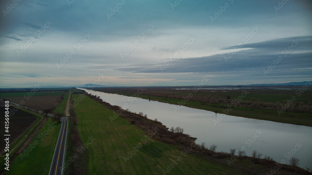 Aerial view over deep water channel heading towards Mount Diablo in the distance 