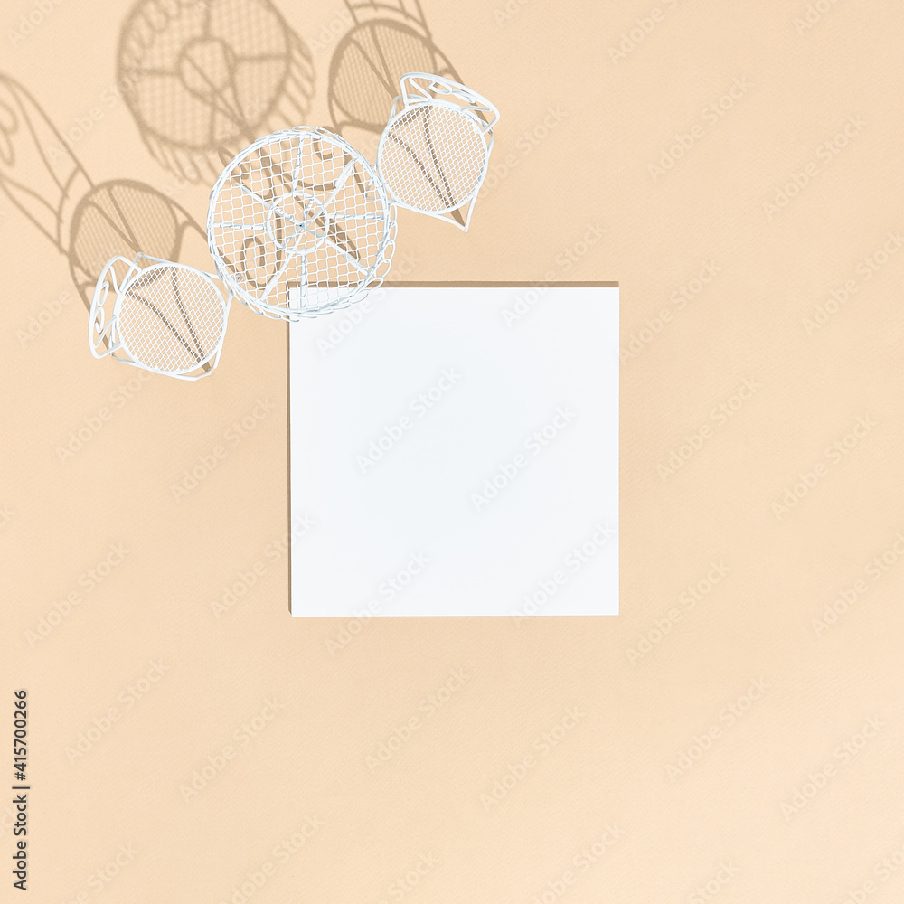 White chair and round table on beige background top view. White empty paper blank in sunshine with hard shadow. Cafe, restaurant, summer, dining concept White chair and round table on beige background top view. White empty paper blank in sunshine with hard shadow. Cafe, restaurant, summer, dining concept