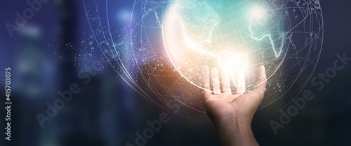 Digital of Virtual Online Global structure networking on Businessman hand in dark background. Technology concepts - Elements of this Image Furnished by NASA.