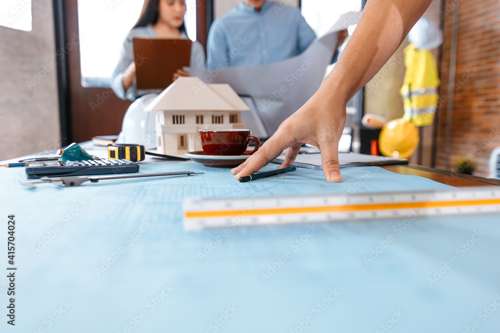 industry manager, engineer, businessman reading and checking blueprint, drawing plan in the room in office. industry manager, engineer, businessman reading and checking blueprint, drawing plan in the room in office.