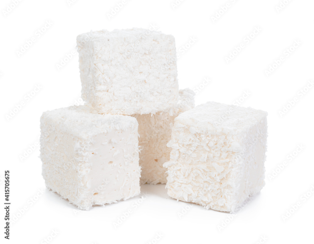 White Turkish delight with coconut shavings isolated on white White Turkish delight with coconut shavings isolated on white
