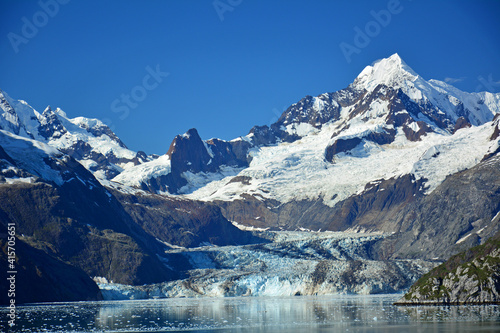 spectacular margerie glacier and surrounding mountain peaks of the fairweather range on a sunny summer day in glacier bay national park, southeast alaska