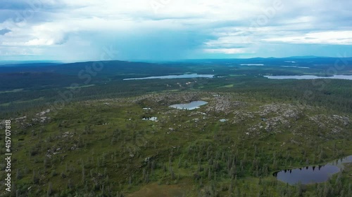 Aerial view around the Sarkitunturi fell, partly sunny day, in Muonio, Lapland, Finland - orbit, drone shot photo