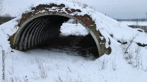 abandoned soviet hangar in winter photo