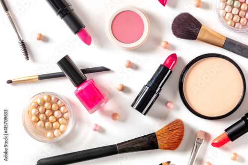 Make-up products, shot from the top on a white background. Various cosmetics