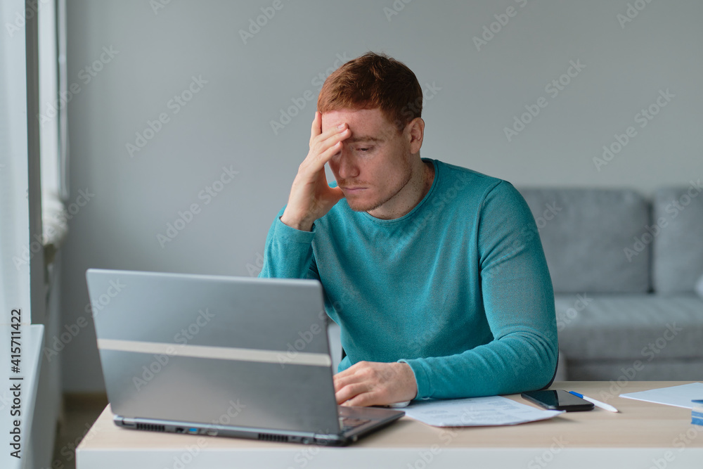 Business man Having Headache While Working Using Laptop Computer. Stressed And Depressed man Touching Head, Feeling Pain While Sitting At Wooden Tabl, Work Failure Concept Business man Having Headache While Working Using Laptop Computer. Stressed And Depressed man Touching Head, Feeling Pain While Sitting At Wooden Tabl, Work Failure Concept