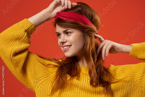cheerful woman yellow sweater glasses fashion clothes studio red background