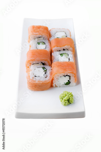 Japanese food restaurant delivery, sushi set . Sushi unagi, tempura rolls california with salmon, shrimp, tuna, caviar and cheese isolated at white background. 