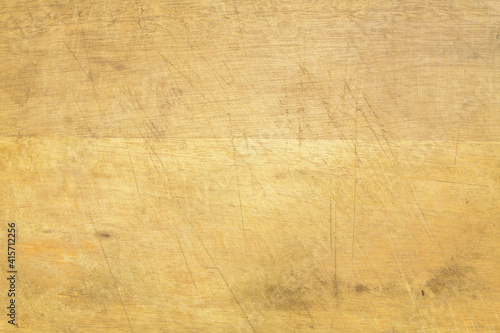 Used grunge wooden kitchen cutting board as background